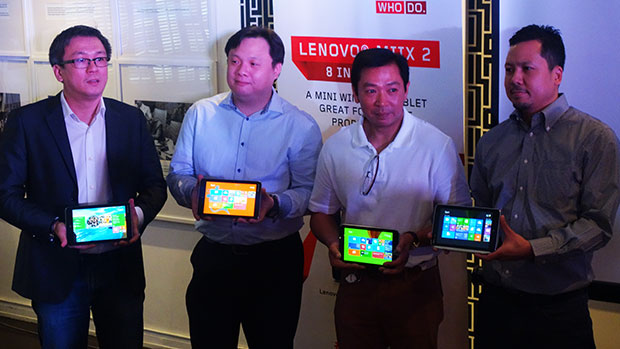 Lenovo and Microsoft executives showing off the 8-inch Miix 2 tablet.