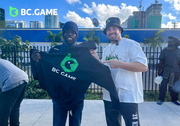 Colby Covington, BC.GAME's brand ambassador, sharing a moment with a recipient of the community charity event in Miami.